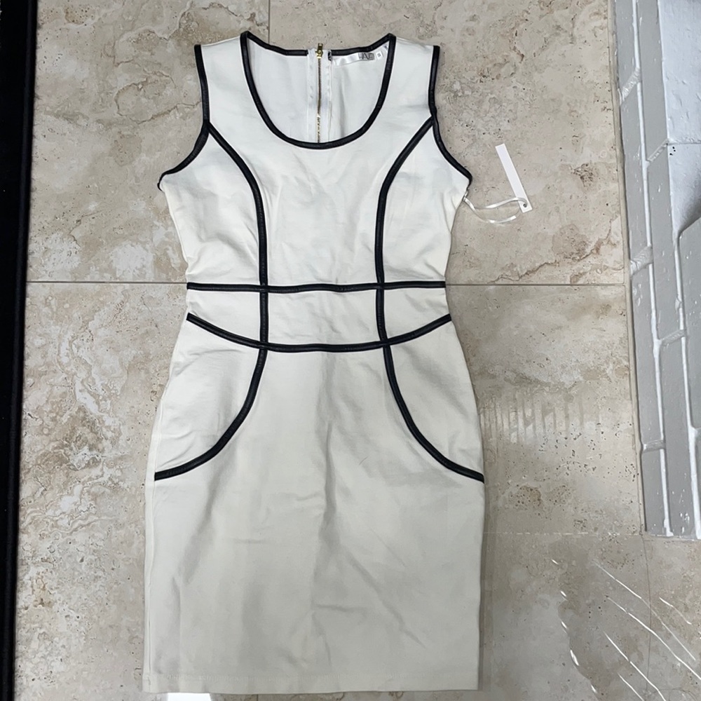 Size S Have white dress w faux leather trim